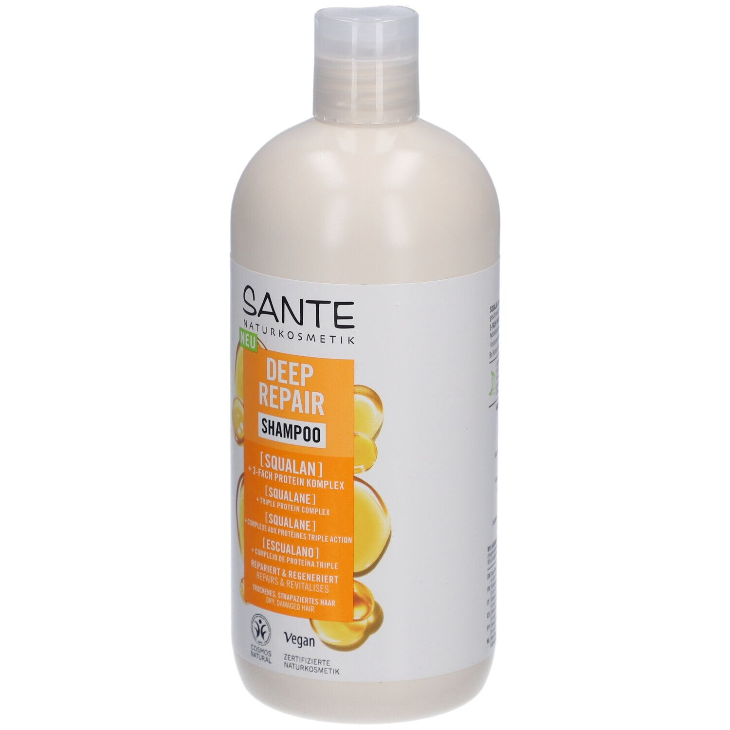 Flacon de shampooing beige avec bouchon blanc. Inscription: SANTE DEEP REPAIR Shampoo. Label Vegan.
