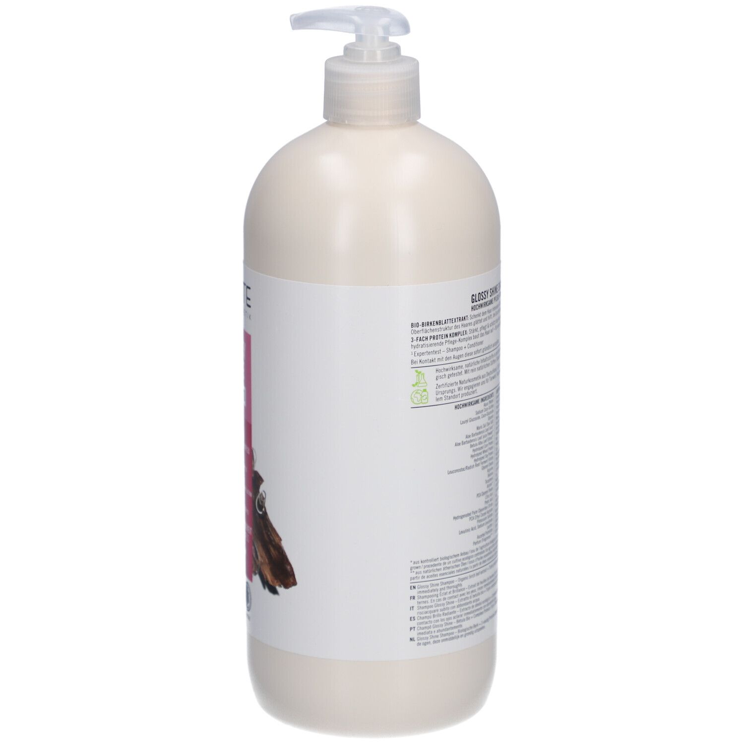 Flacon de shampooing beige avec pompe. Vue arrière avec étiquette et informations produit. Label Vegan visible.