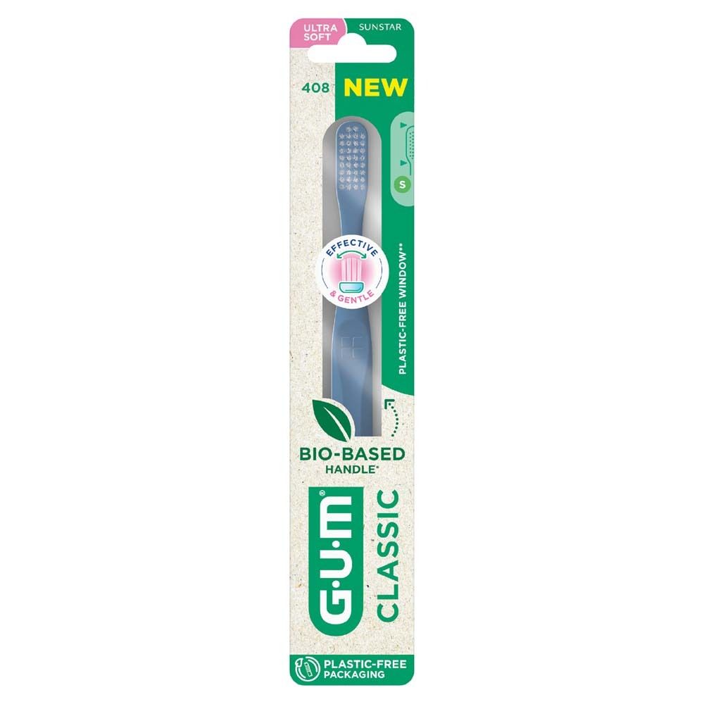 Brosse à dents GUM Classic ultrasoft dans son emballage. Manche bleu, soies blanches. "BIO-BASED HANDLE" et "PLASTIC-FREE PACKAGING".