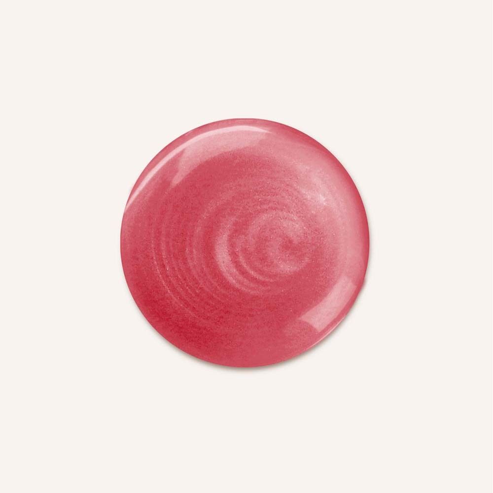 Goutte de shampooing rouge sur fond blanc. Texture brillante, forme circulaire.