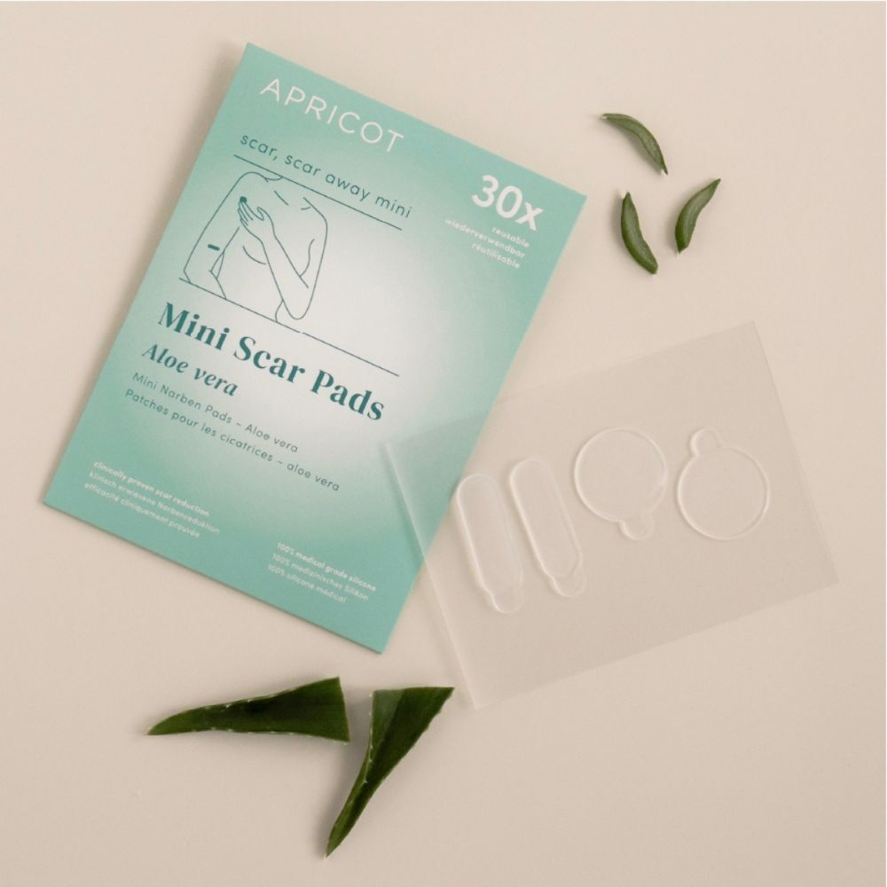 Boîte de Mini Scar Pads APRICOT et feuilles d'aloe vera. Coussinets de différentes formes.