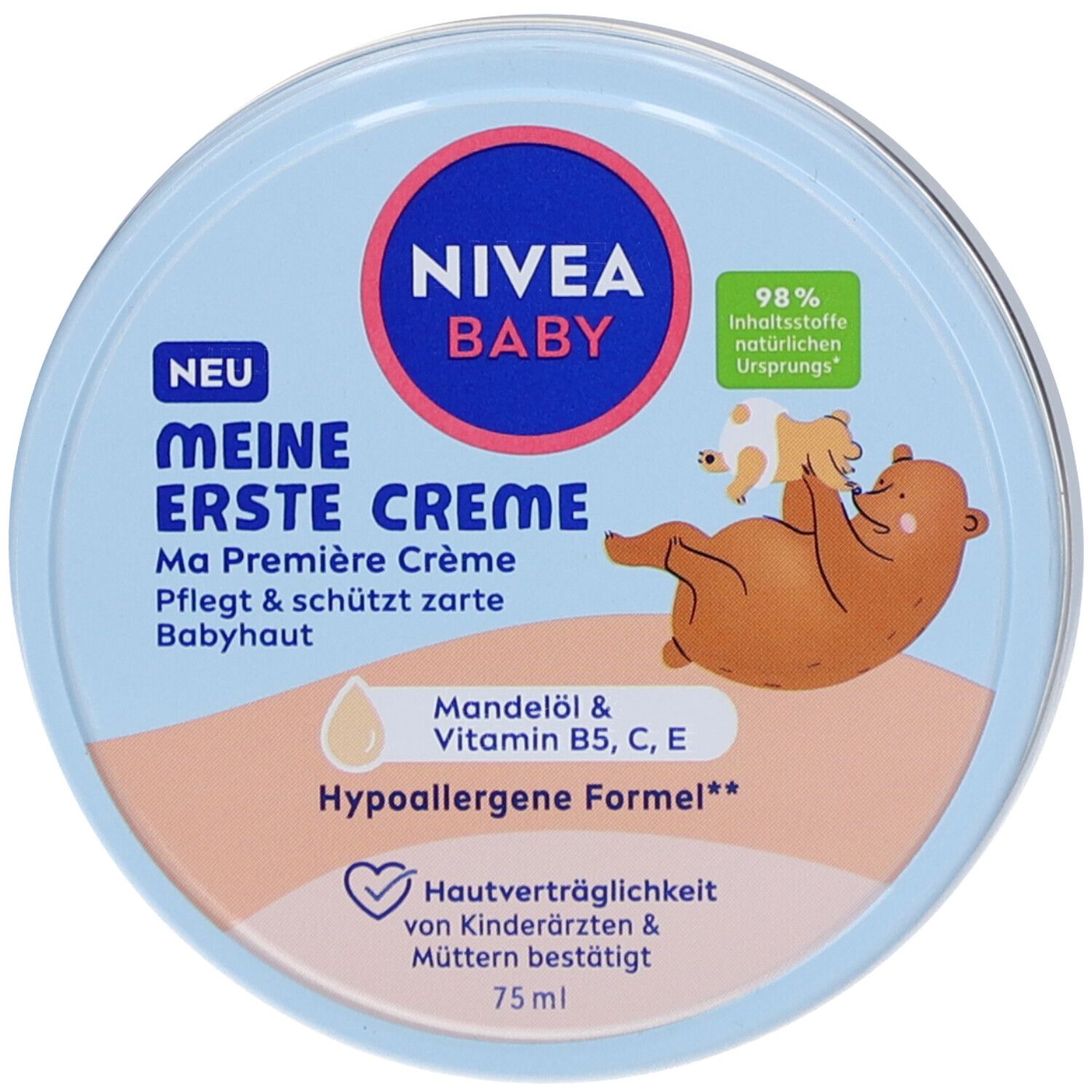 Pot bleu clair avec couvercle. Inscription : NIVEA BABY Meine erste Creme. Illustration : bébé et ours. Ingrédients.