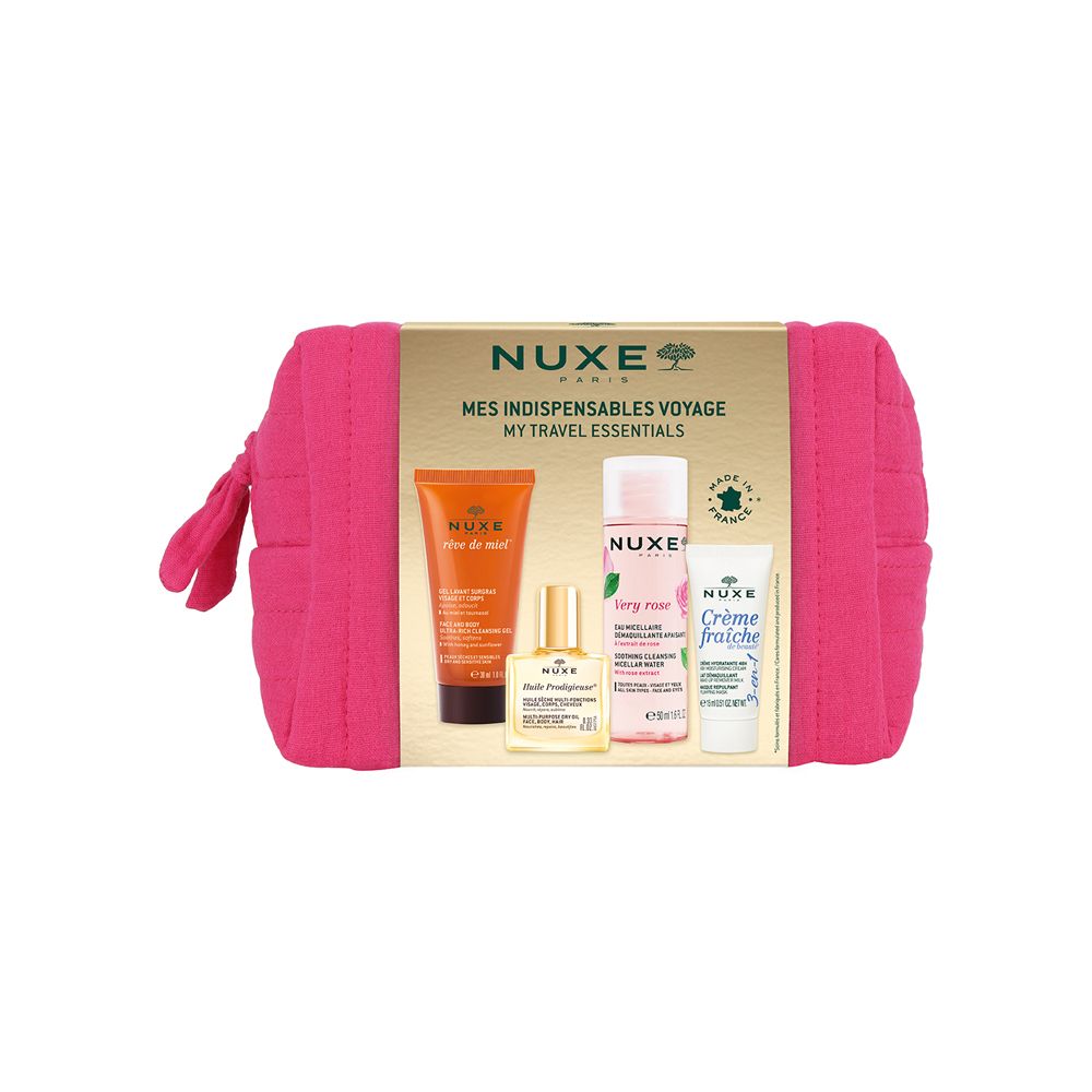 Trousse de toilette rose avec produits. Emballage doré avec noms de produits. Logo NUXE visible.