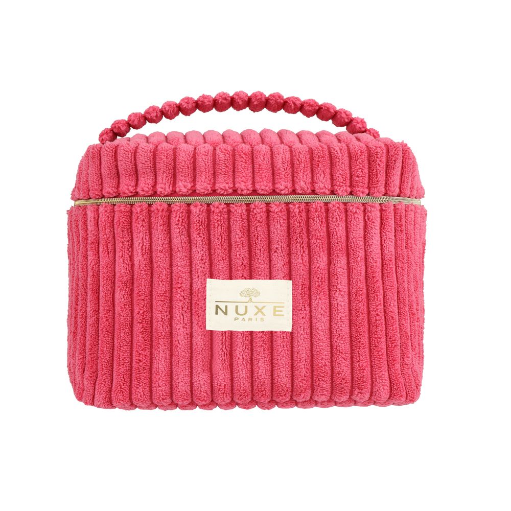 Trousse de toilette rose à surface côtelée et fermeture éclair. Avec poignée et logo NUXE sur le devant.