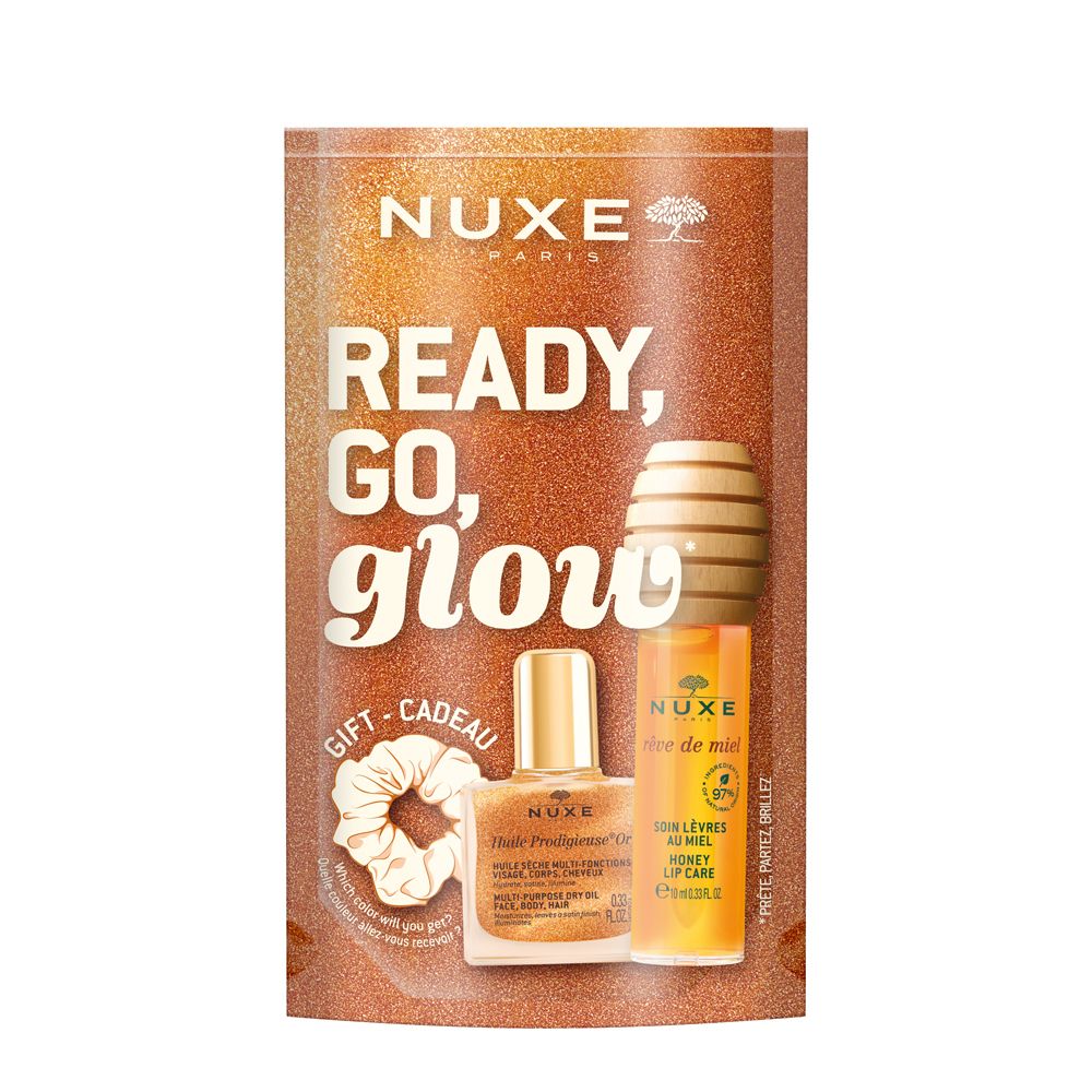 Coffret cadeau NUXE. Contient soin lèvres au miel, huile sèche, chouchou et design en nid d'abeille. Inscription « Ready, Go, Glow ».