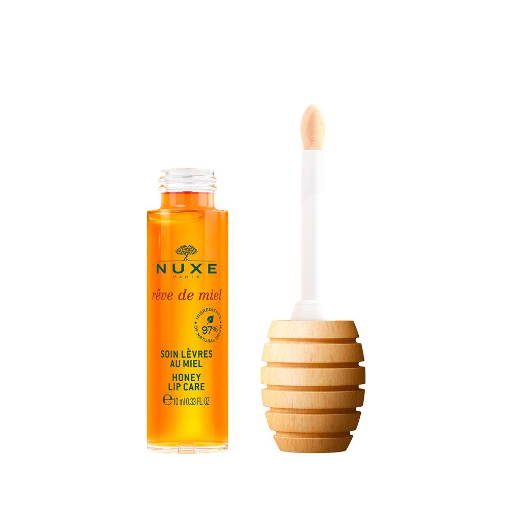 Soin lèvres au miel NUXE en flacon de verre avec applicateur en bois. Contient 97% d'ingrédients d'origine naturelle.
