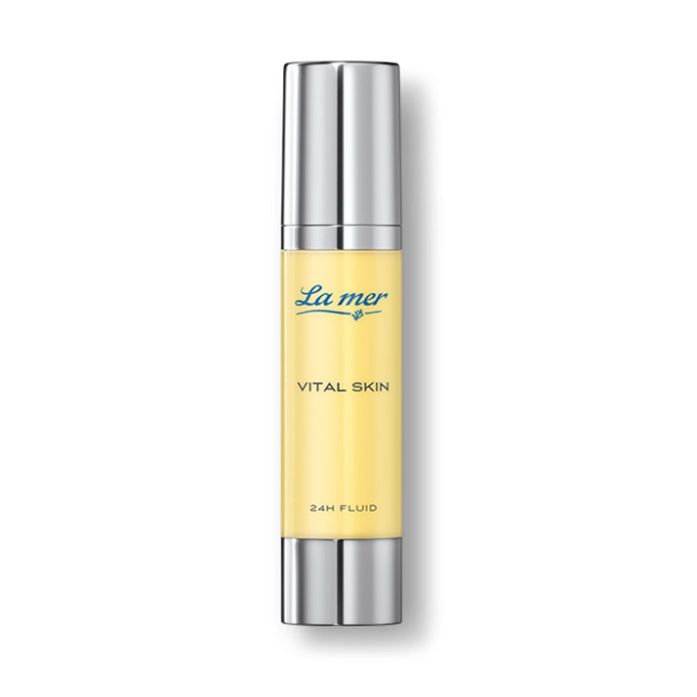 Flacon cylindrique avec bouchon argenté. Inscription: La mer, Vital Skin, 24H Fluid. Liquide jaune visible.