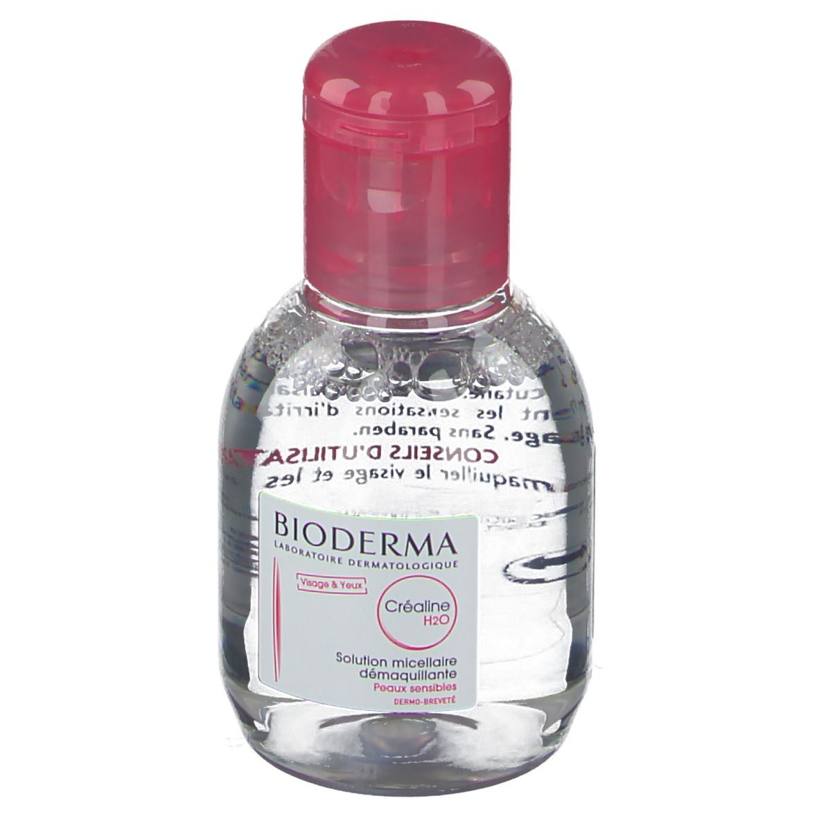 Petite bouteille ovale avec bouchon rose. Inscription: BIODERMA, Créaline H2O, Solution micellaire. Pour peaux sensibles.