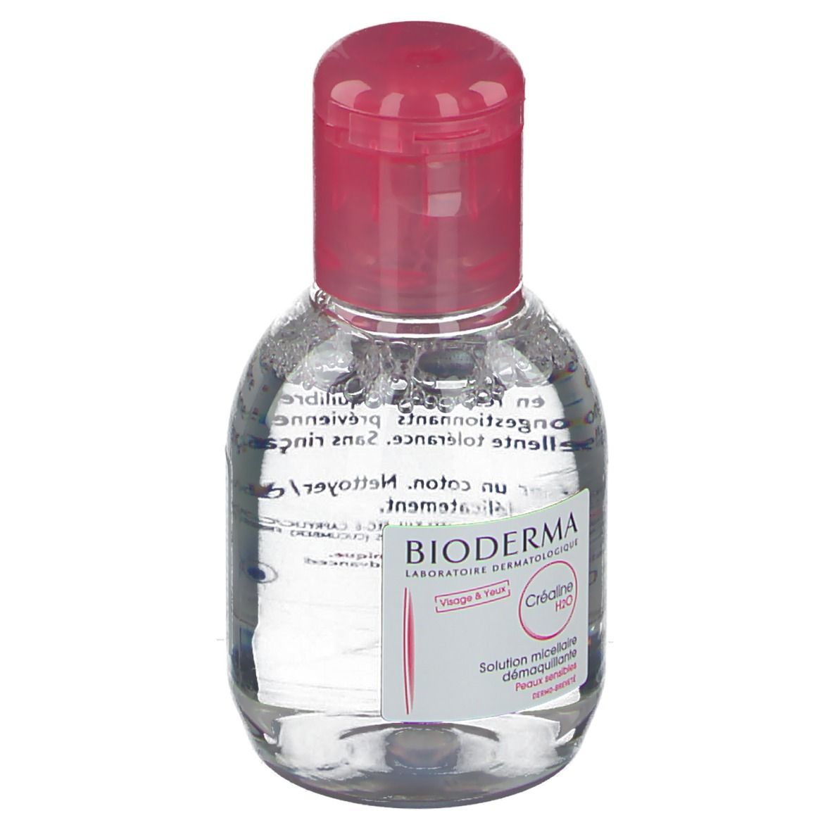 Petite bouteille ovale avec bouchon rose. Inscription: BIODERMA, Créaline H2O, 100. Pour peaux sensibles.