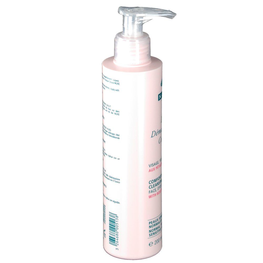 Flacon rose avec pompe, vue en biais. Inscription: Nuxe, Demaquillant Confort, visage, yeux, lèvres. Texte en anglais et français.