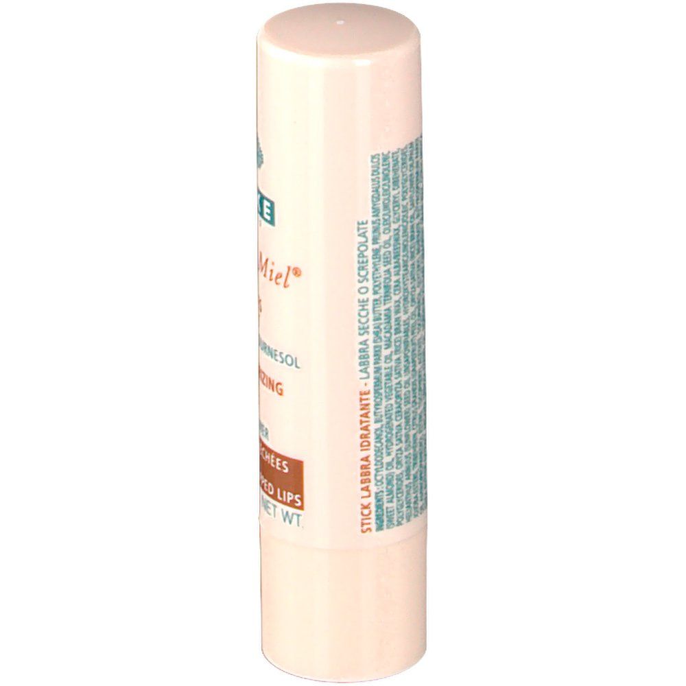 Stick à lèvres, vue latérale. Texte: Stick Labbra Idratante, Labbra Secche O Screpolate. Ingrédients en plusieurs langues.