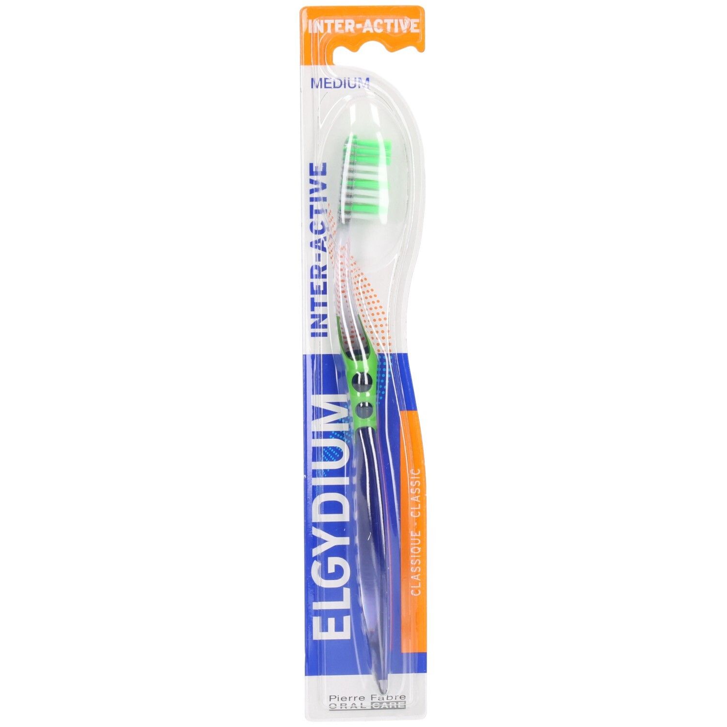 Brosse à dents dans emballage. Soies vertes, manche transparent. Inscription: ELGYDIUM INTER-ACTIVE, MEDIUM.