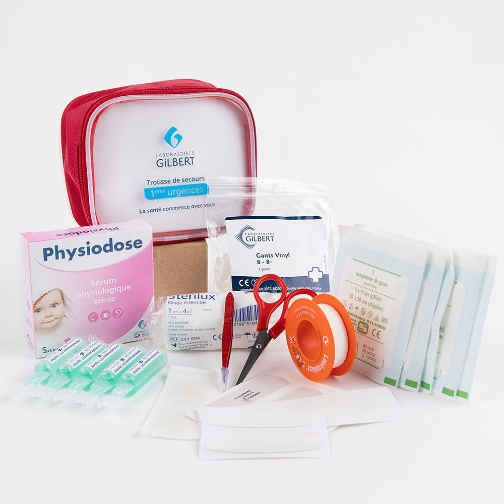Trousse de secours avec contenu. Contient: sérum, pansements, ciseaux, pince à épiler, sparadrap, gants. Produits supplémentaires.