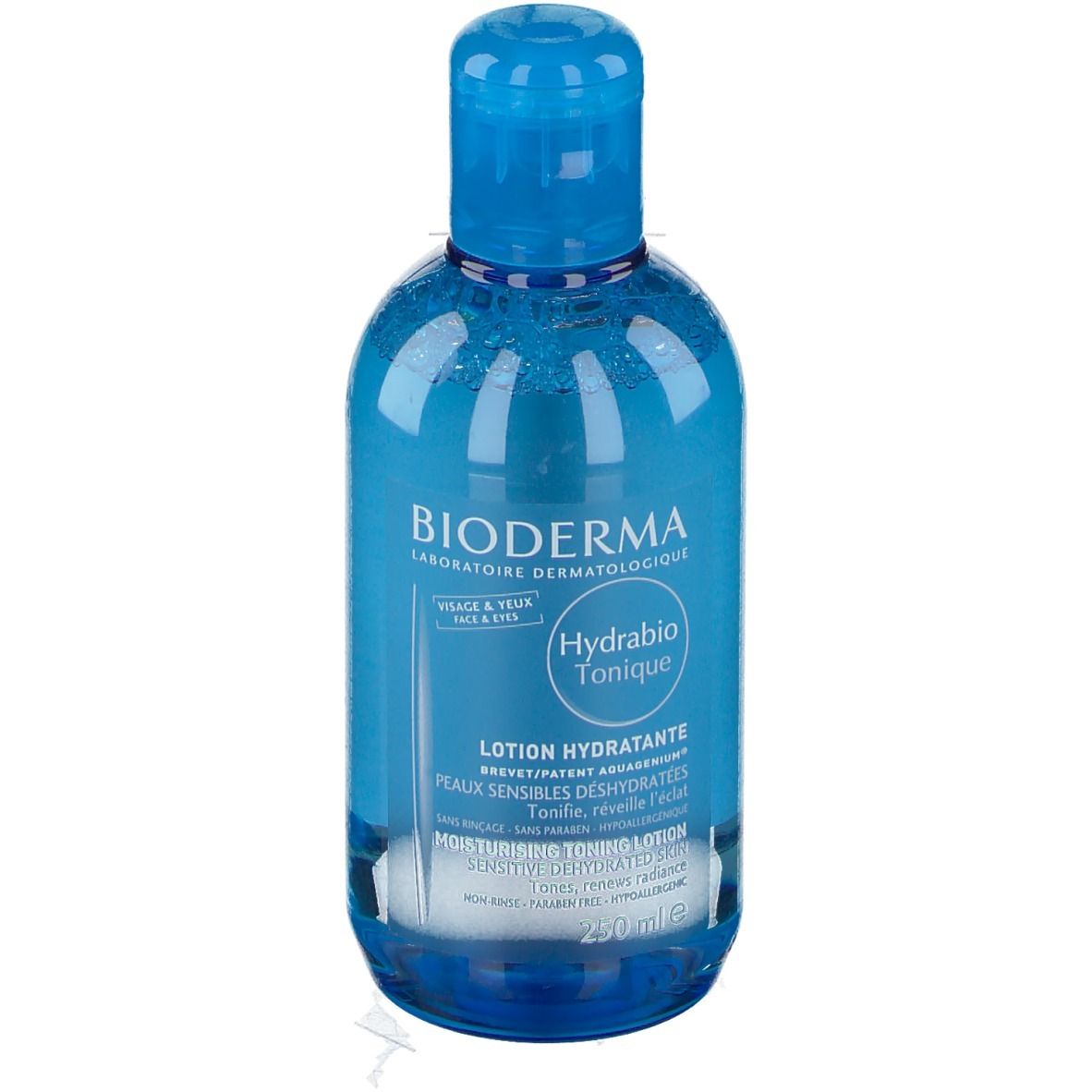 Flacon bleu transparent avec bouchon bleu. Inscription: BIODERMA, Hydrabio Tonique, Lotion Hydratante. Pour le visage et les yeux.
