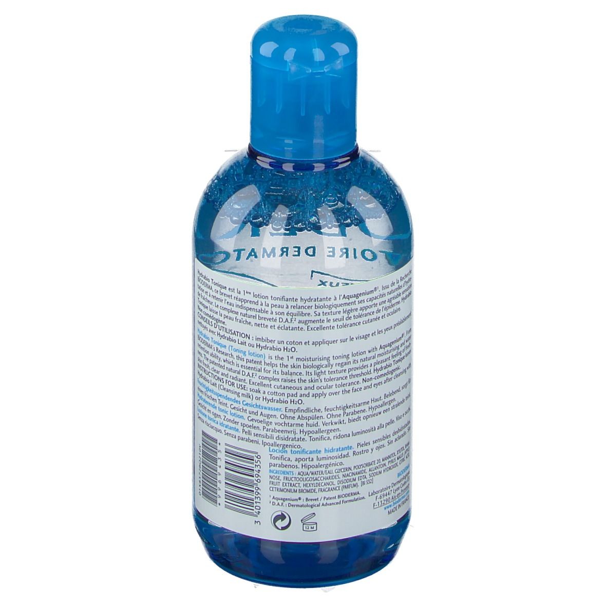 Vue arrière du flacon bleu. Informations sur le produit en plusieurs langues. Informations du fabricant et code-barres.