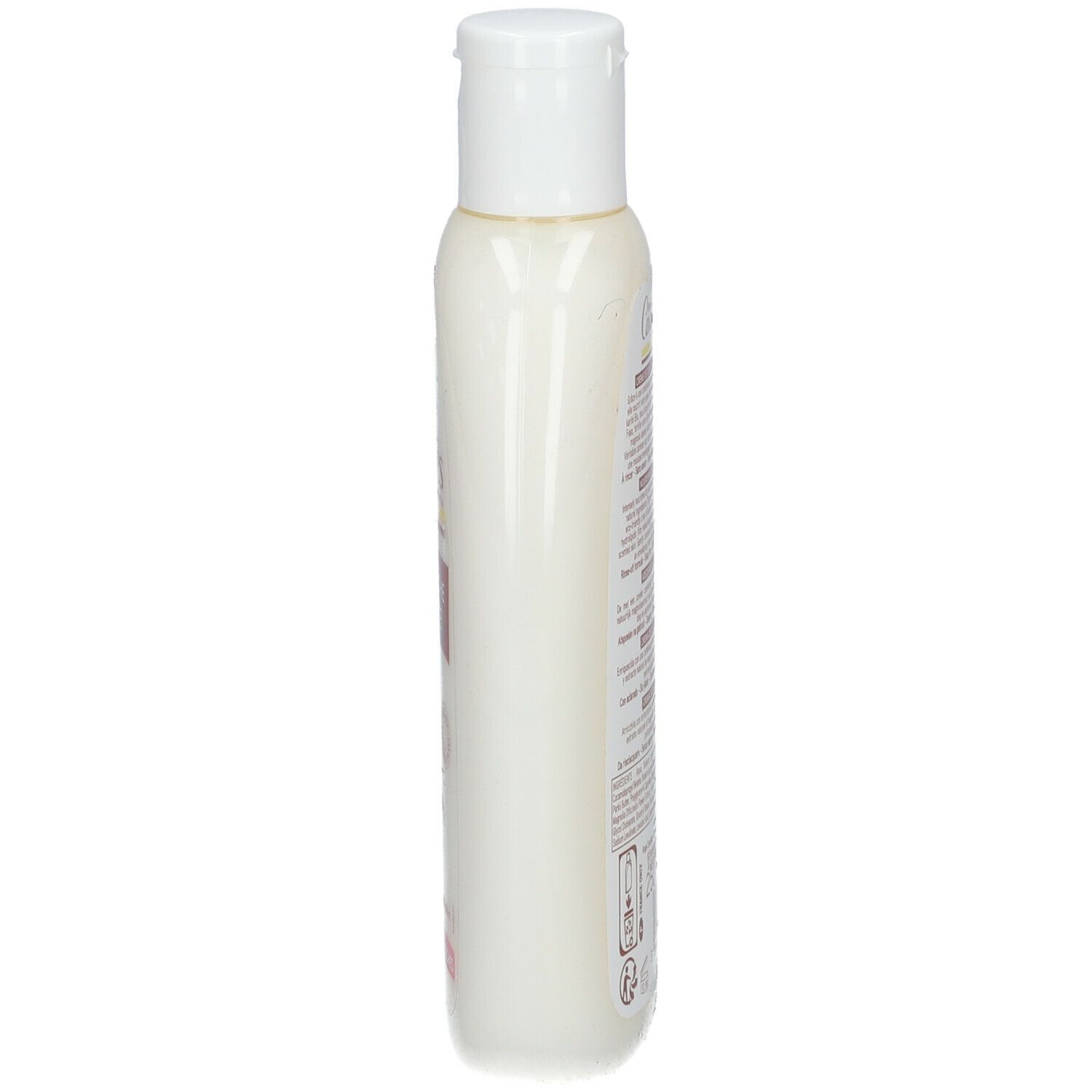 Flacon blanc étroit avec bouchon blanc. Inscription: Rogé Cavaillès. Étiquette avec texte. Vue latérale.
