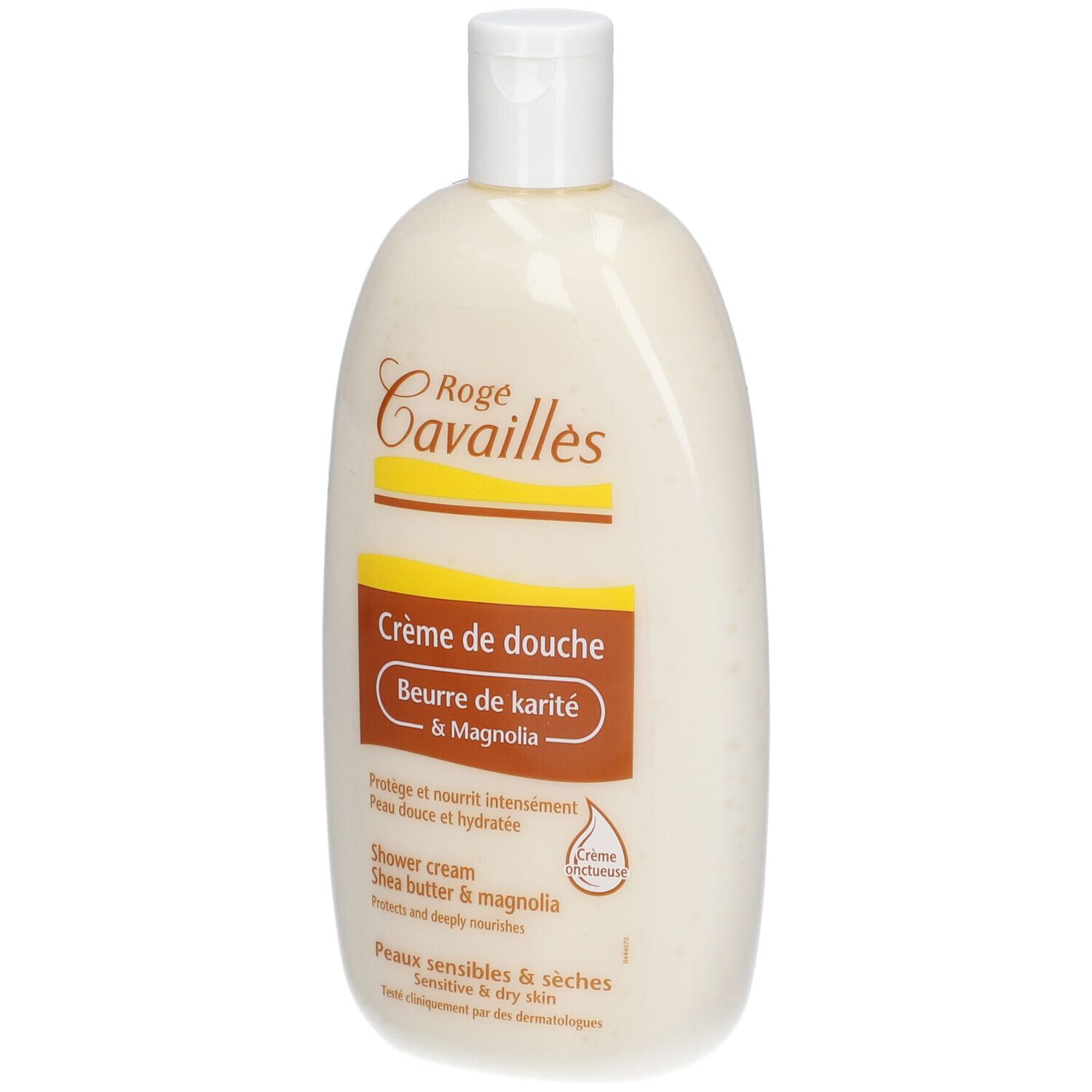 Flacon de crème de douche. Logo Rogé Cavaillès. Texte : Crème de douche, Beurre de karité & Magnolia. Pour peaux sensibles. Flacon blanc à bouchon rabattable.