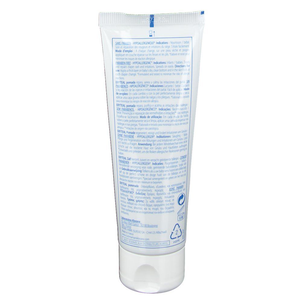 Tube blanc avec texte. Dos du tube avec informations produit et logos. Emballage en plastique.