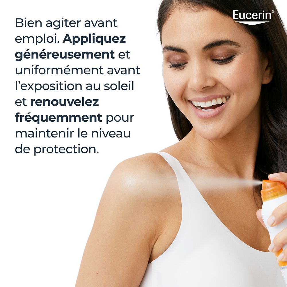 Femme vaporisant Eucerin Sun Protection LSF 50 Oil Control Spray sur la peau. Texte : Bien agiter avant emploi.
