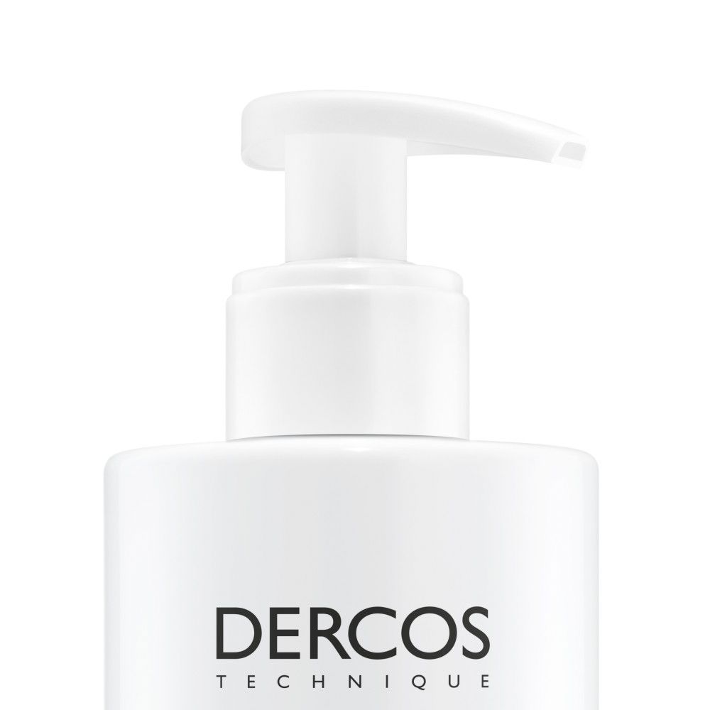 Gros plan de la pompe et du flacon blancs. Dercos.