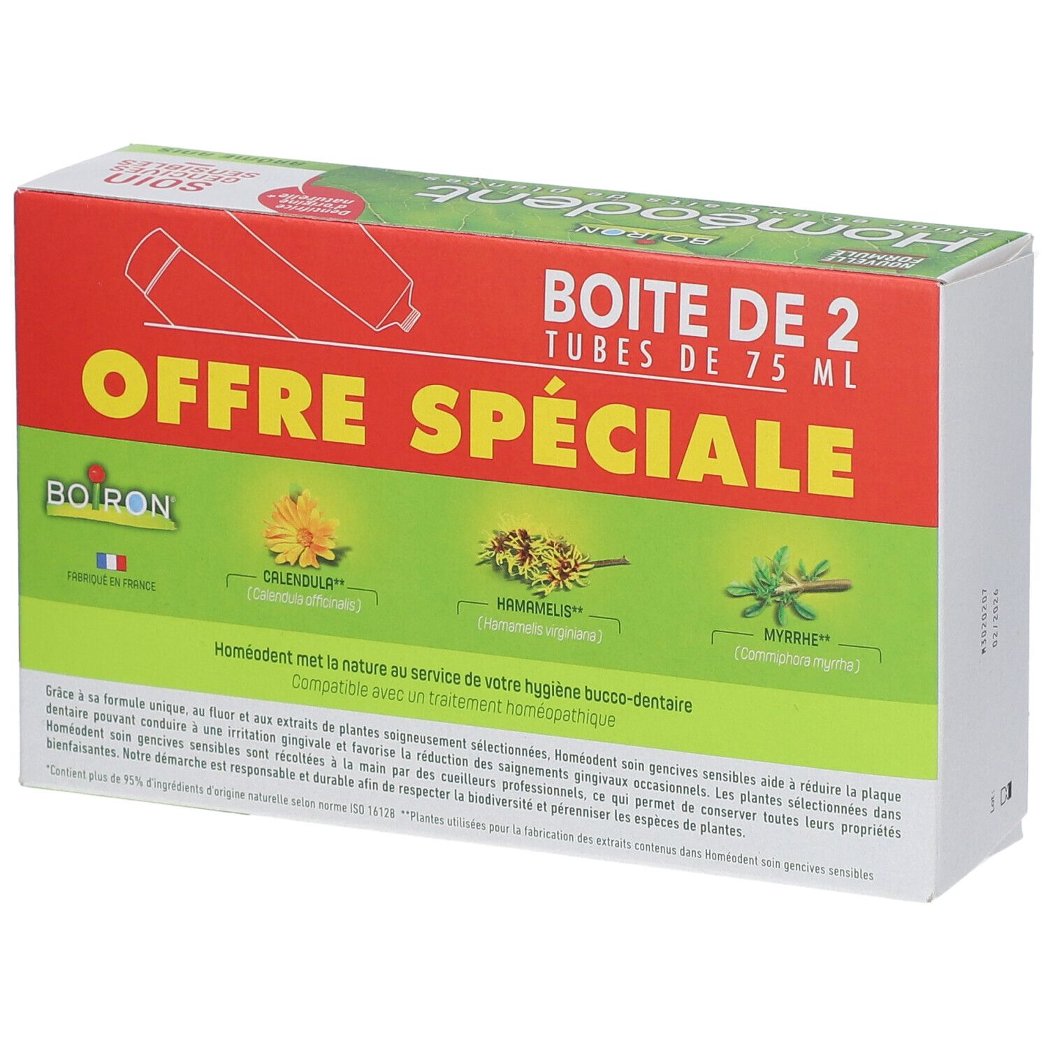 Boîte de dentifrice verte et rouge, avec nom du produit, illustrations de plantes et texte.