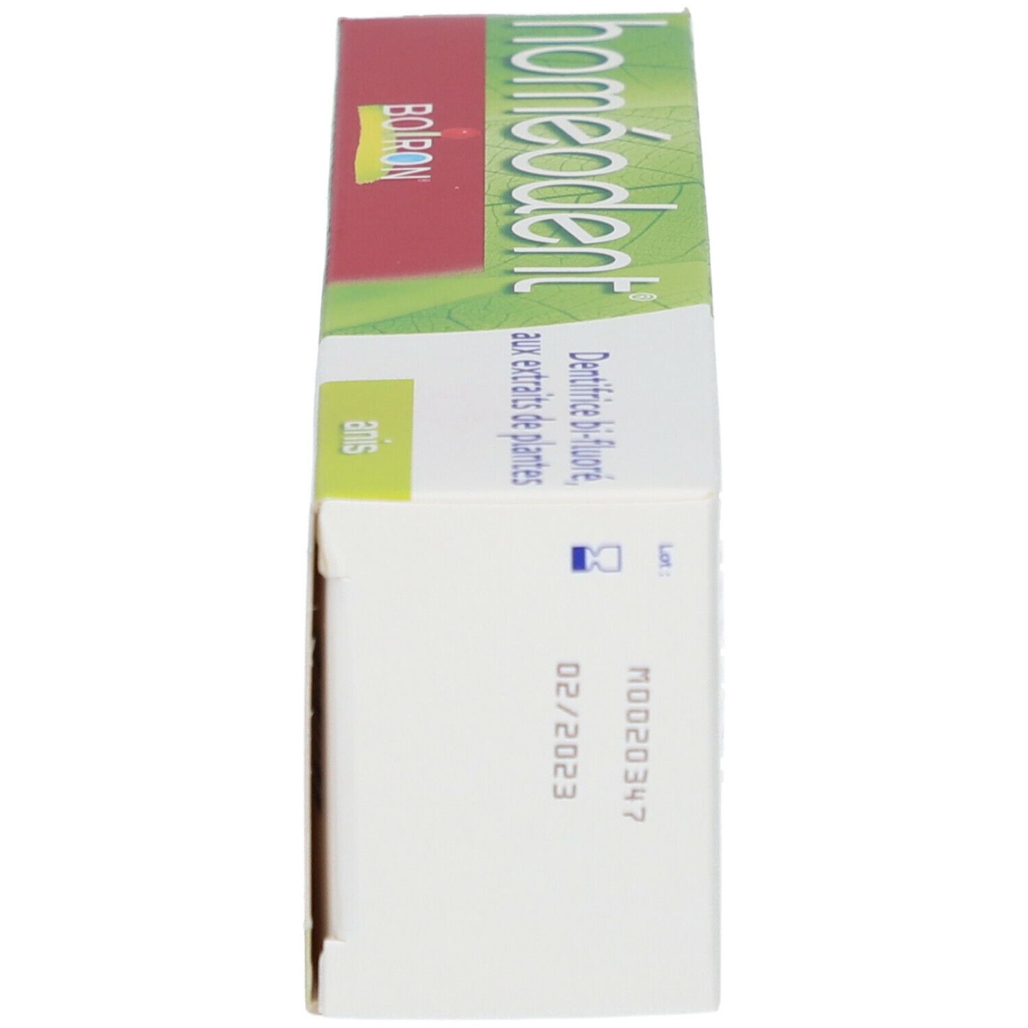 Boîte de dentifrice Homeodent. Côté avec texte et logo. Inscription 'Homeodent' et 'Boiron'. Date de péremption.