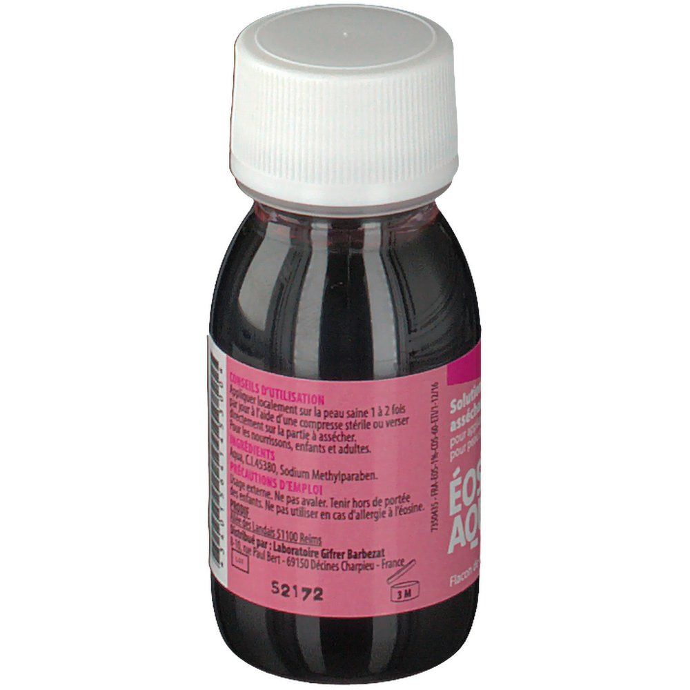 Flacon d'Éosine Aqueuse 1% avec liquide rouge, bouchon blanc et étiquette rose. Texte sur l'étiquette.