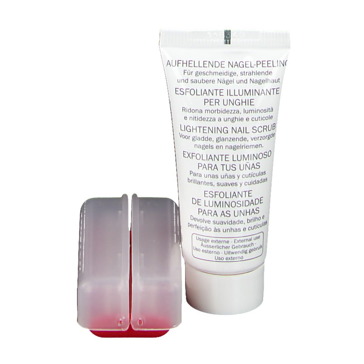 Tube de gommage pour ongles avec deux applicateurs. Inscriptions multilingues: Lightening Nail Scrub, Exfoliant Lumineux.