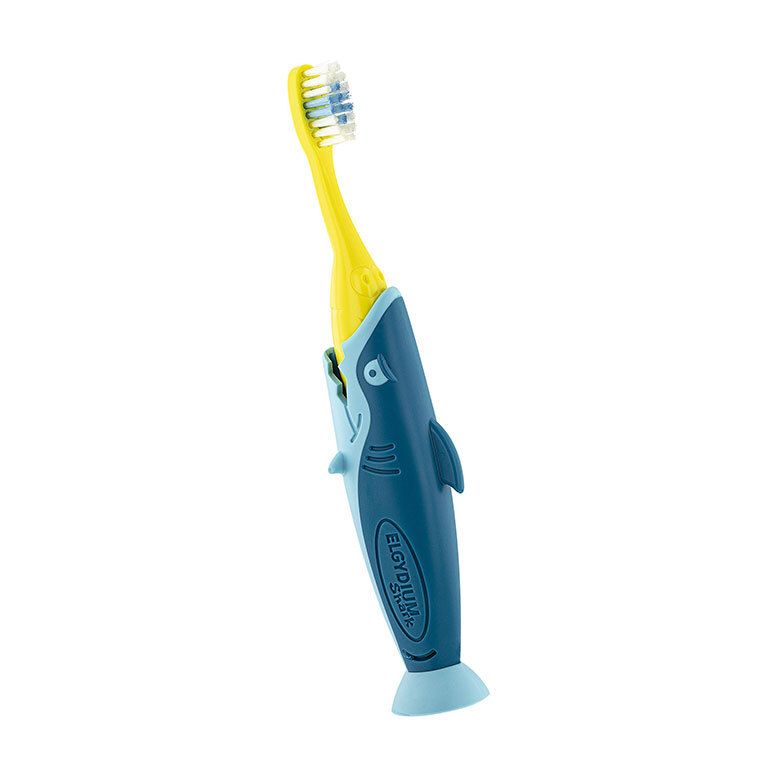 Brosse à dents enfant jaune avec manche bleu en forme de requin. Poils souples.