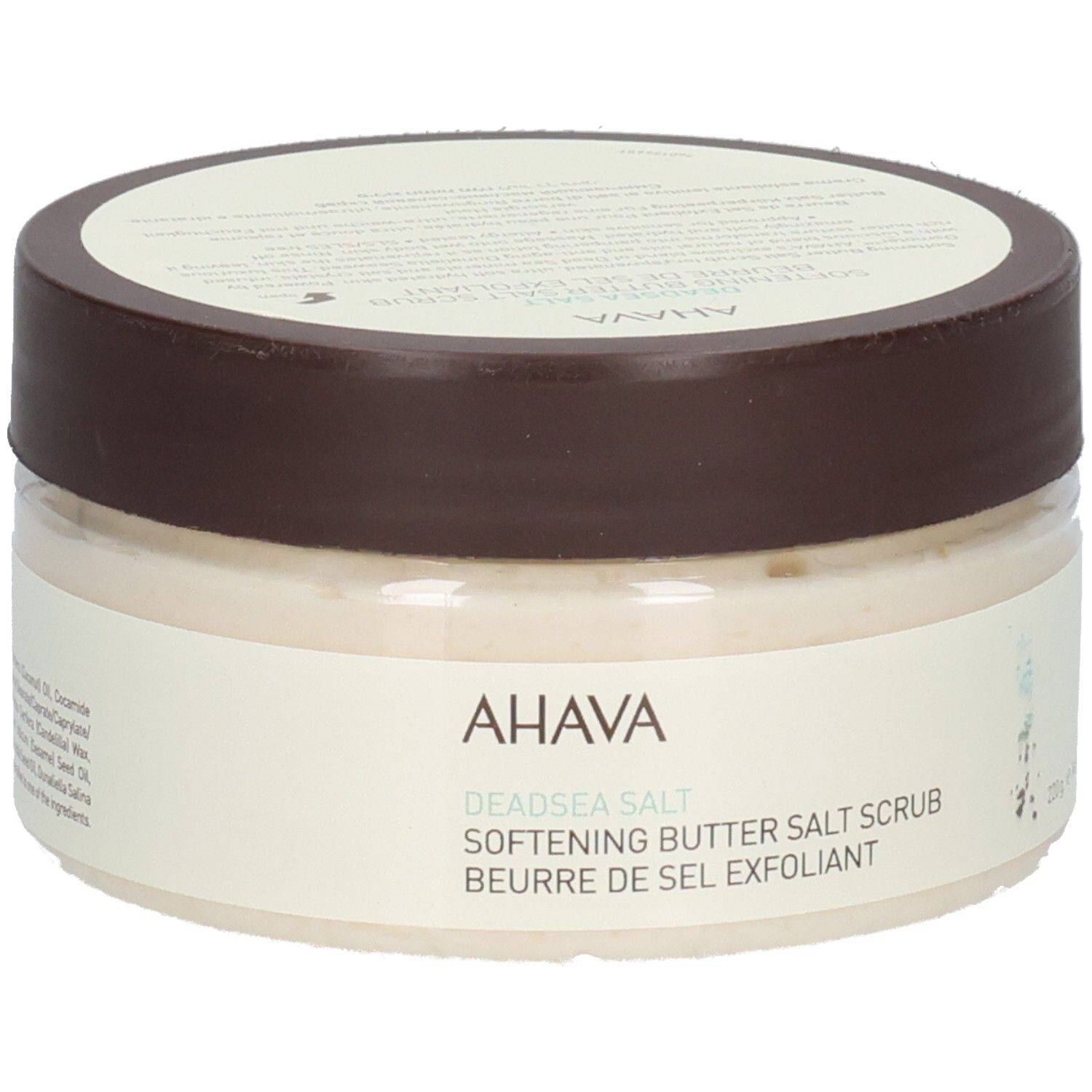 Produit Ahava. Récipient rond transparent avec couvercle marron. Inscription : AHAVA, Deadsea Salt, Softening Butter Salt Scrub, Beurre de Sel Exfoliant.