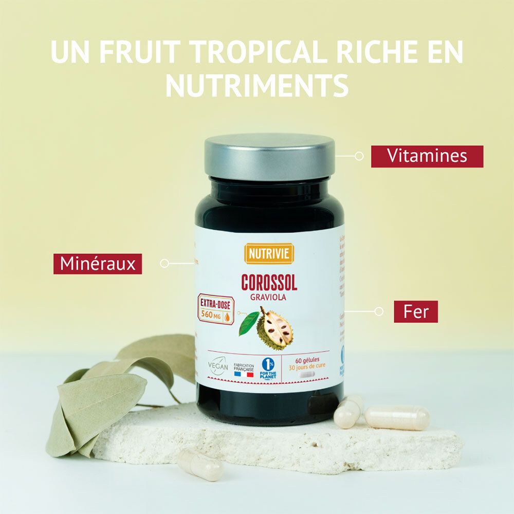 Bouteille de gélules Corossol Graviola avec indications vitamines, minéraux, fer. Deux gélules à côté.