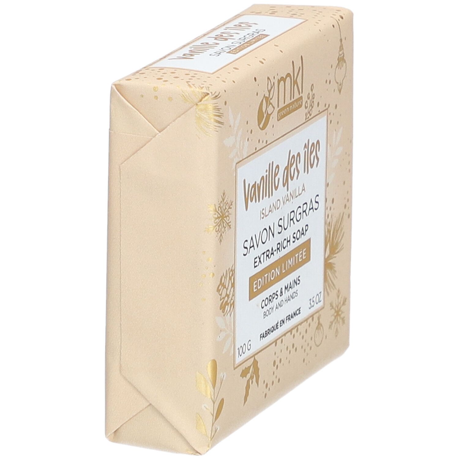 Bloc de savon incliné emballé dans du papier. Inscription : Vanille des Iles, Savon Surgras, Extra-Rich Soap. Edition Limitée.
