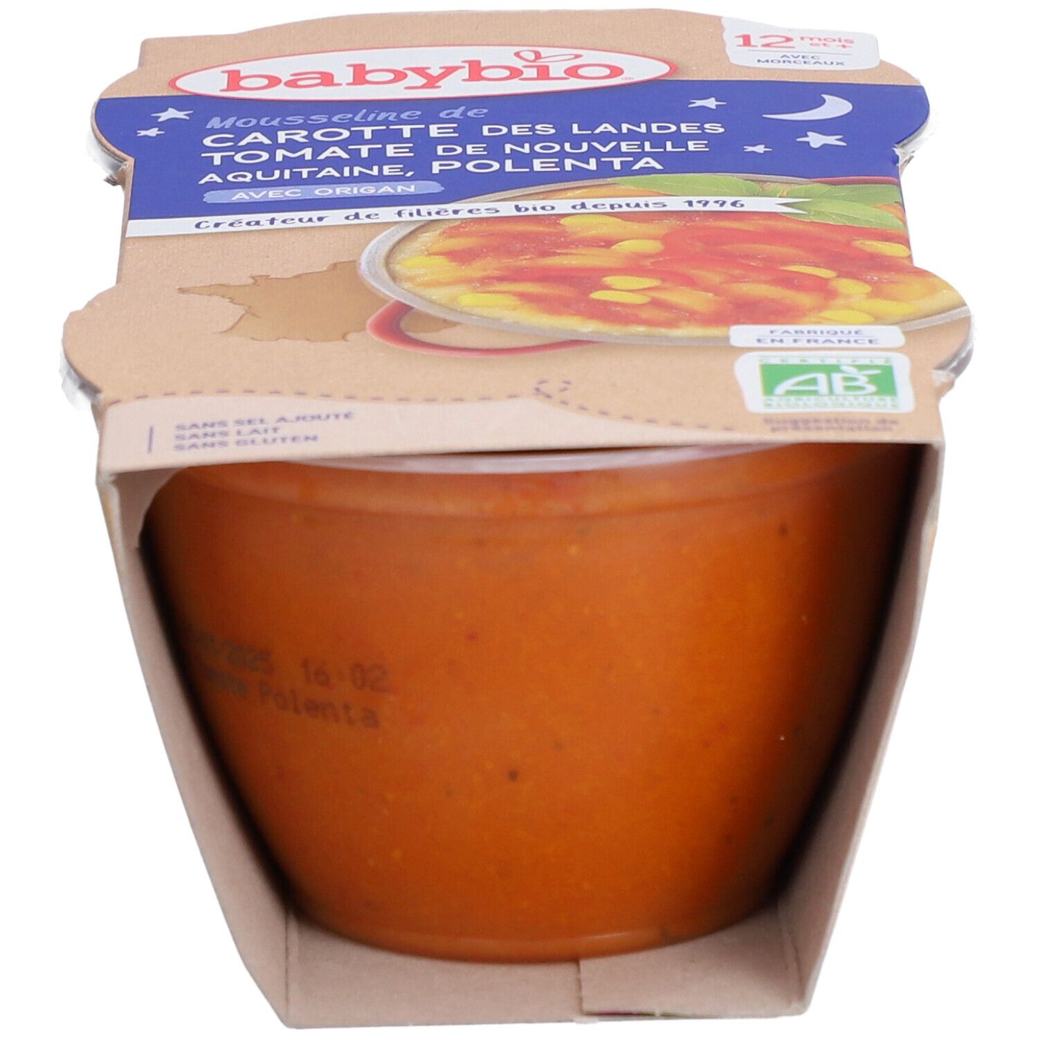 Emballage Babybio Mousse de carottes, tomates et polenta. Le pot est partiellement visible, avec des informations sur le produit.