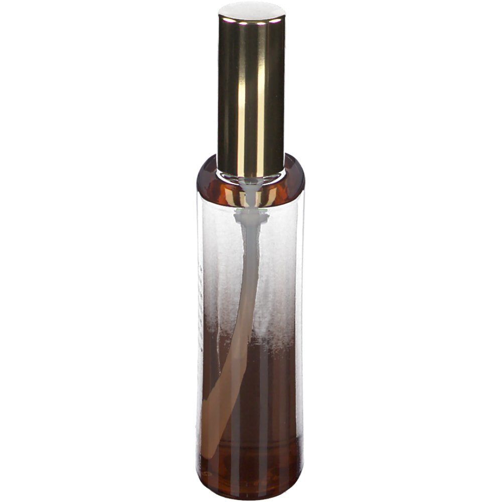 Flacon de parfum cylindrique avec bouchon doré. Dégradé de marron à transparent.