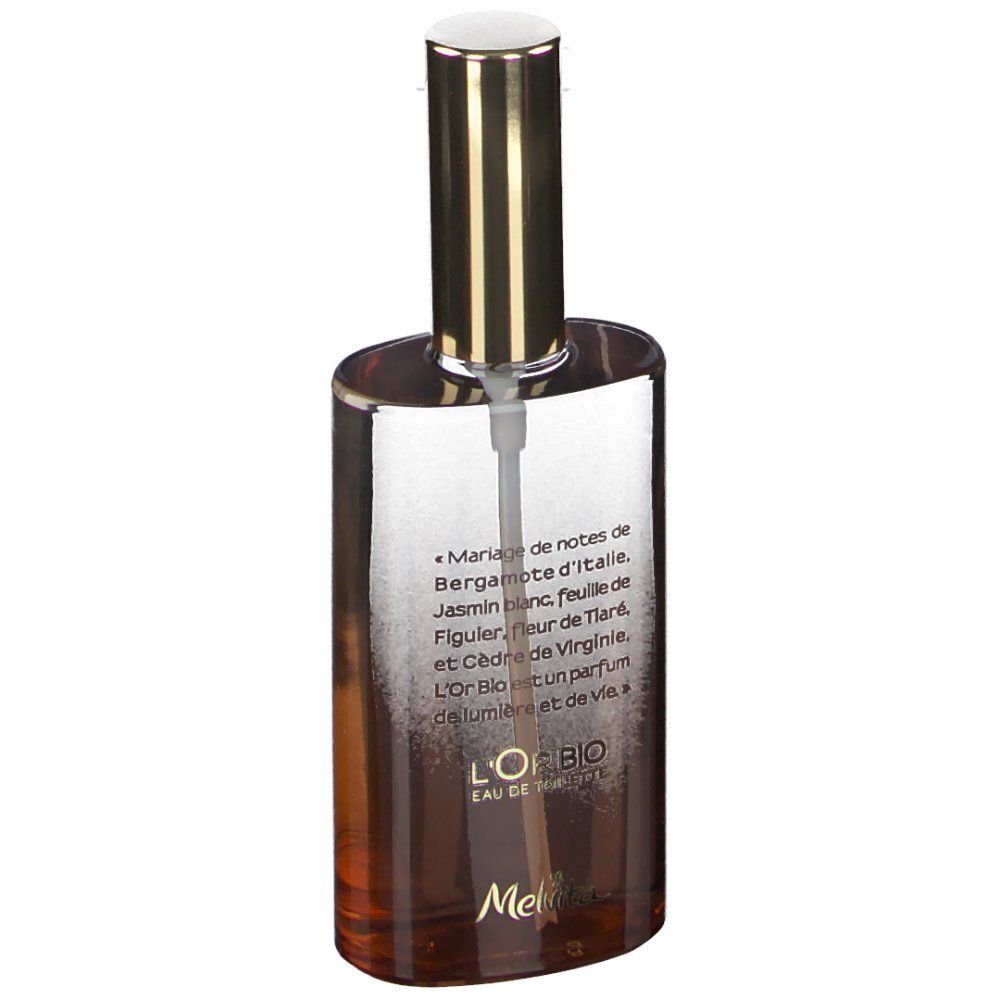 Flacon de parfum avec bouchon doré. Inscription: L'Or Bio Eau de Toilette. Texte avec ingrédients.