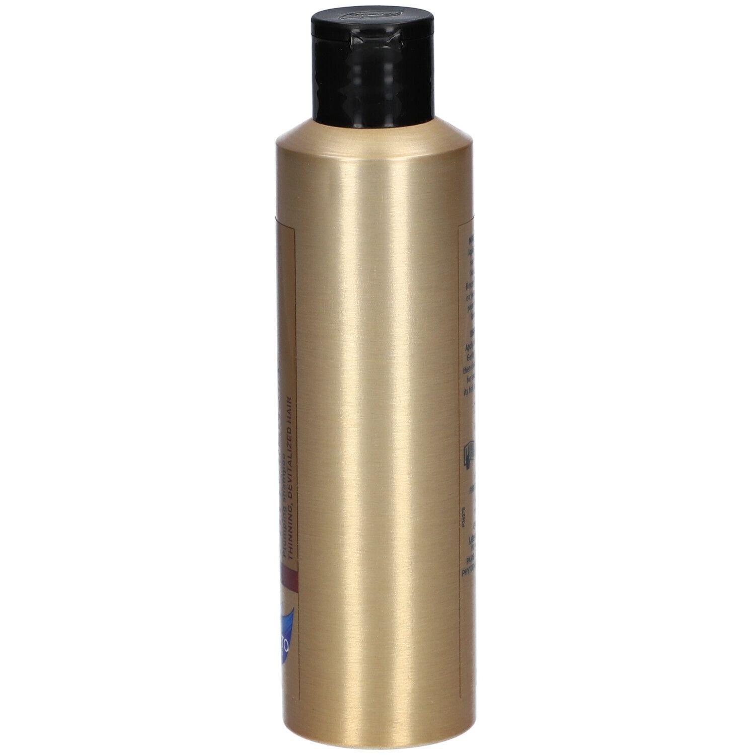 Flacon de shampooing doré avec bouchon noir. Texte sur le côté, probablement des informations sur le produit.