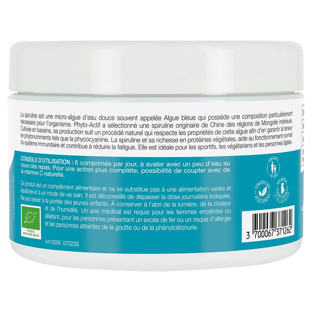 Dos du produit blanc rond. Étiquette bleue avec instructions d'utilisation et avertissements. Texte.