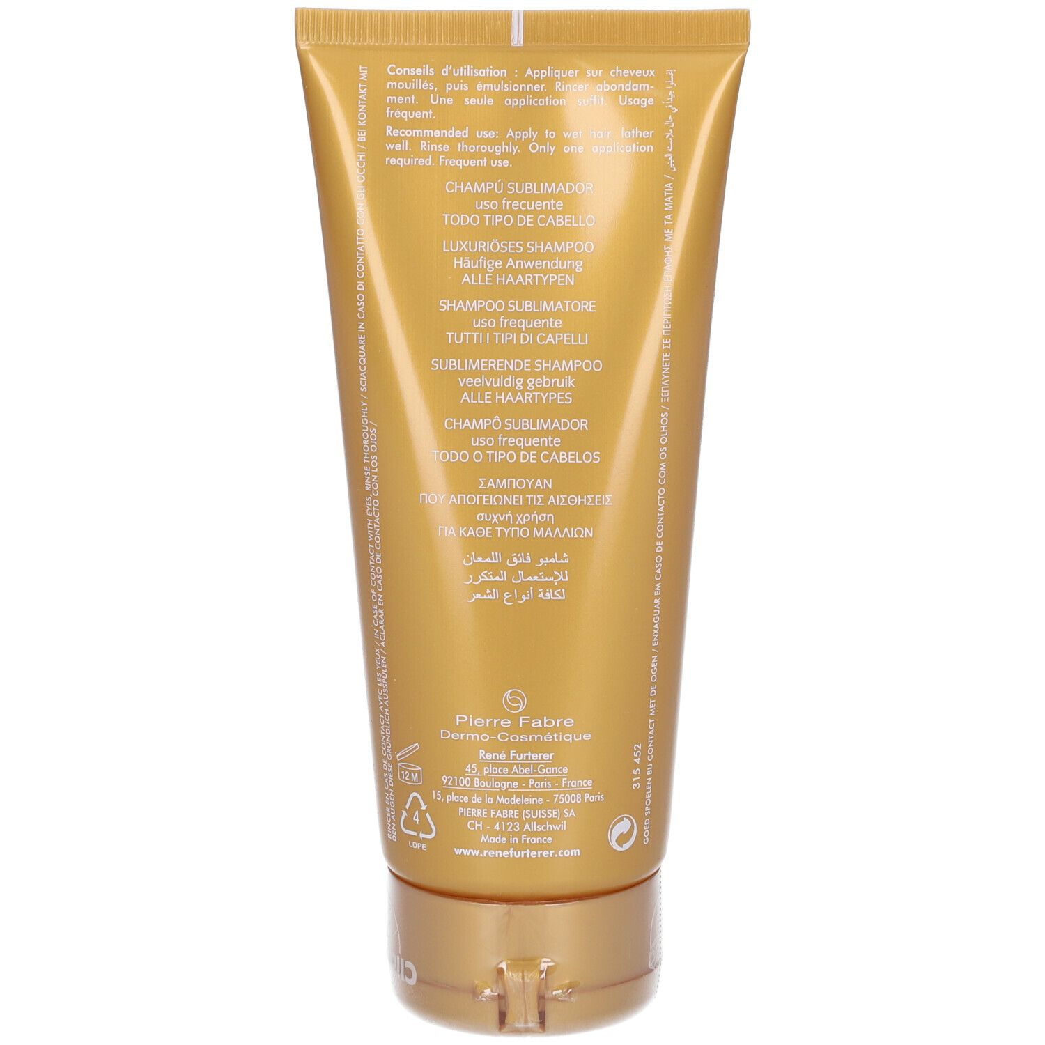 Dos du tube de shampooing doré. Texte multilingue. Informations du fabricant.