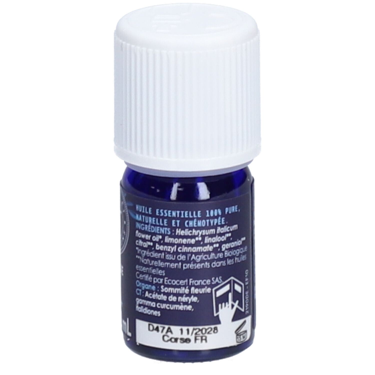 Petite bouteille en verre bleu avec bouchon blanc. Inscription: Huile essentielle 100% pure. Étiquette avec ingrédients.