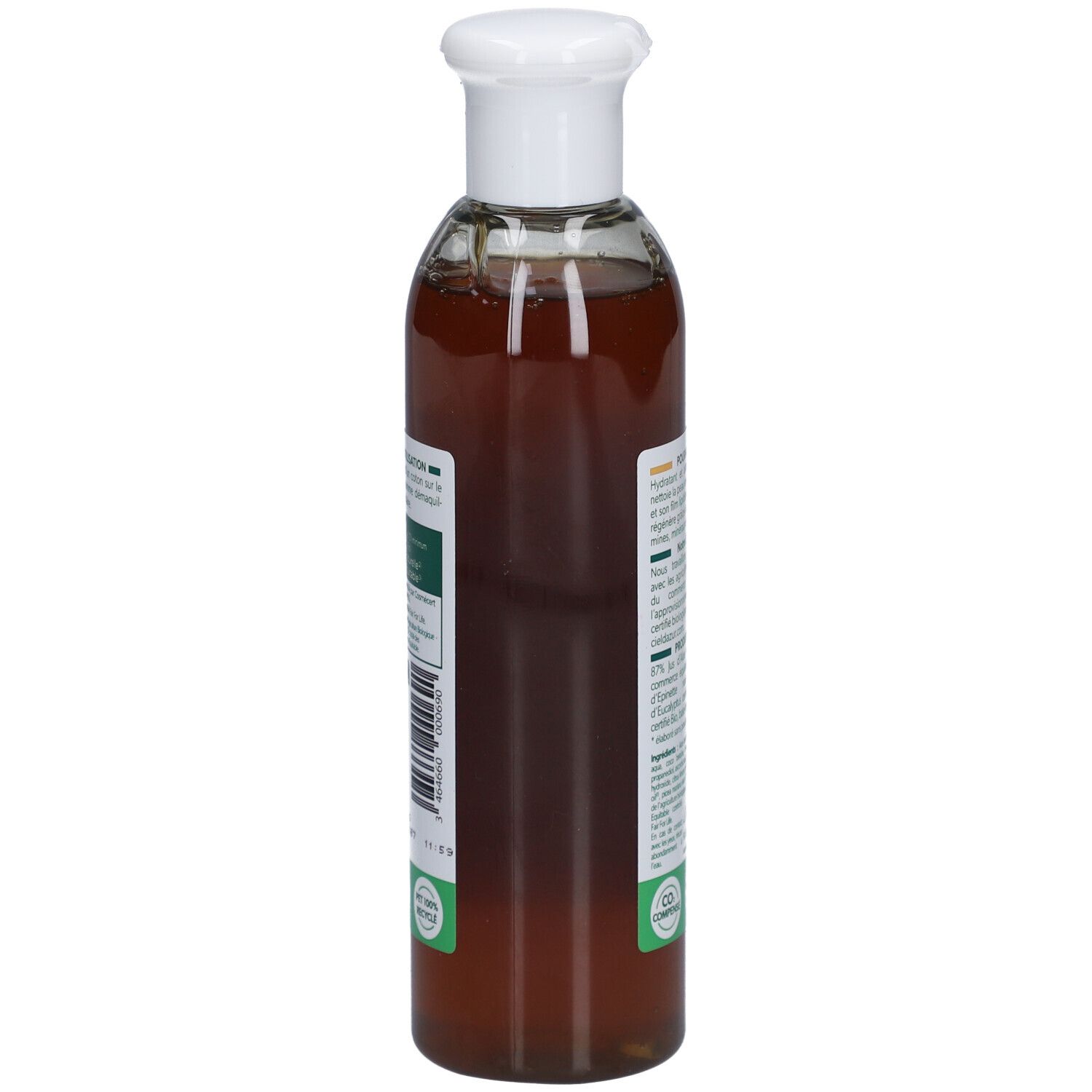 Vue latérale du flacon. Étiquette avec informations produit et code-barres. Liquide transparent visible.