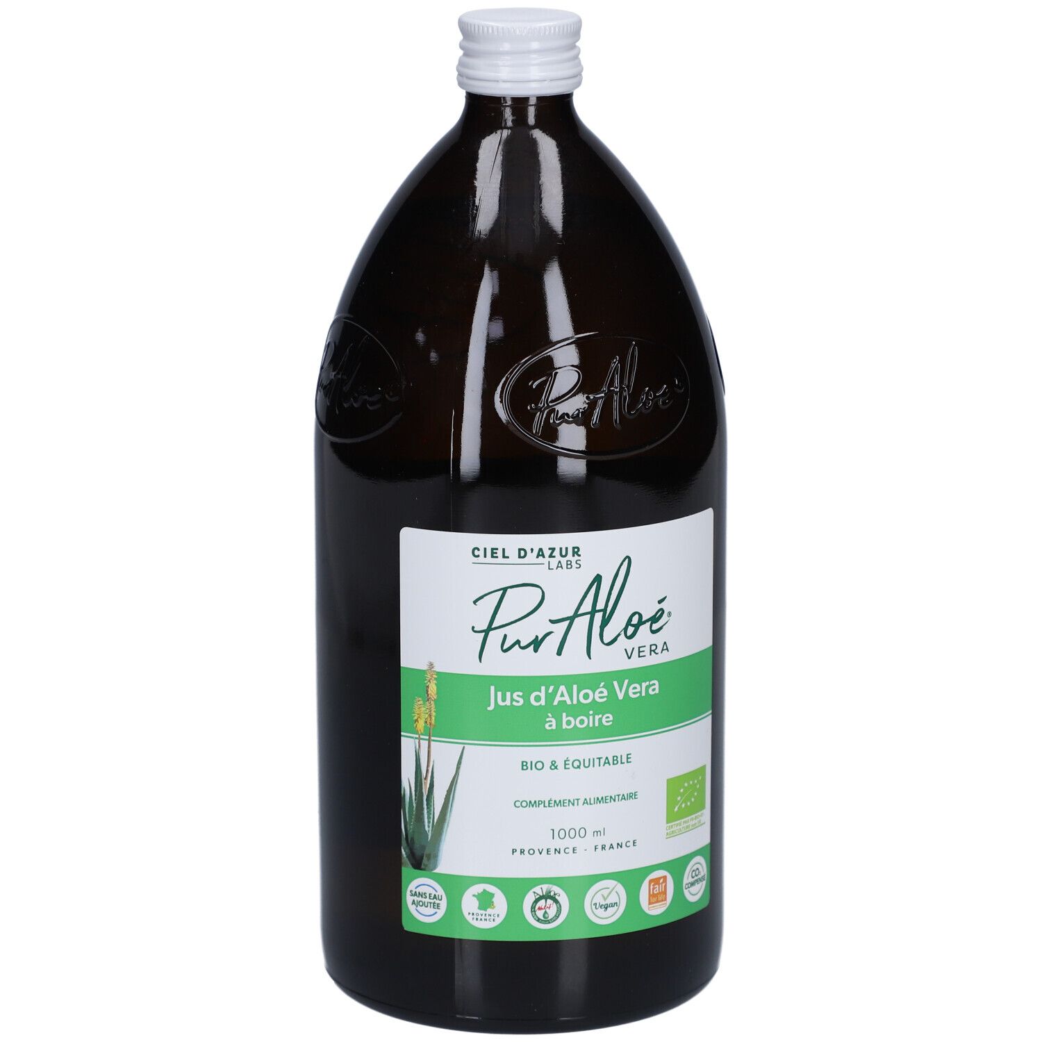 Bouteille en verre brun avec bouchon blanc. Étiquette : PurAloé Vera, Jus d'Aloé Vera à boire. Certification bio.