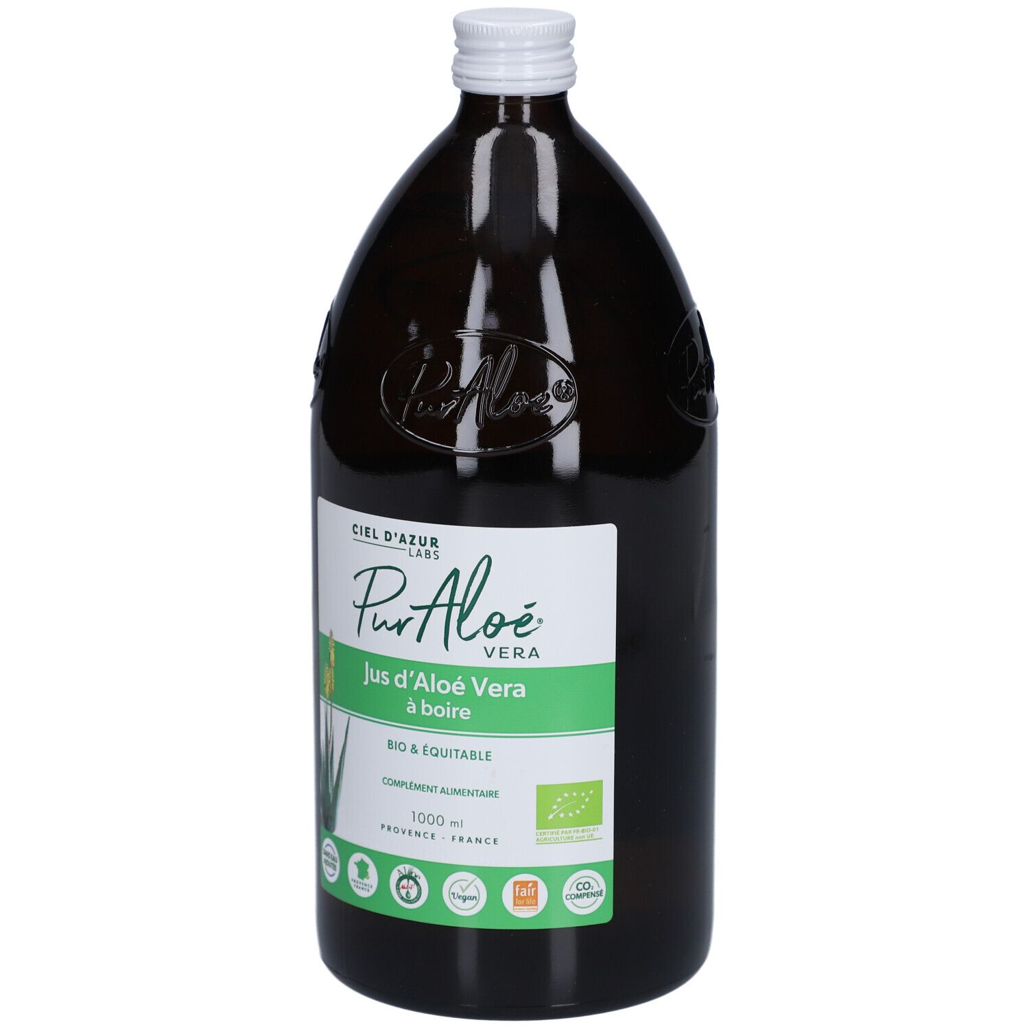 Bouteille en verre brun avec bouchon blanc. Étiquette : PurAloé Vera, Jus d'Aloé Vera à boire. Certification bio.