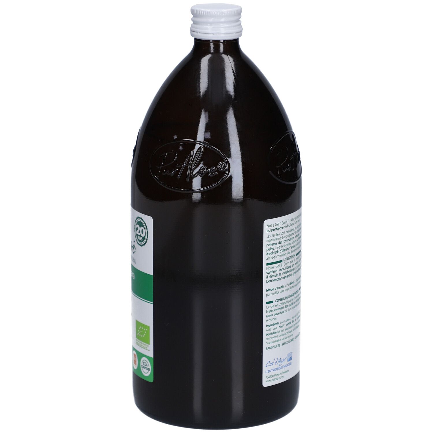 Bouteille en verre brun, bouchon blanc. Étiquette avec texte et code-barres. Vue arrière.