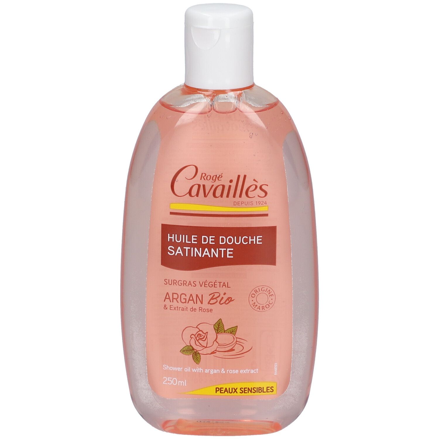 Flacon transparent, liquide rose. Bouchon blanc. Inscription: Rogé Cavaillès, Huile de Douche Satinante, Argan Bio.
