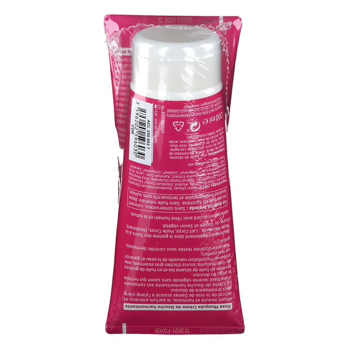 Tube rose avec bouchon blanc, emballé dans du plastique transparent. Texte sur l'étiquette, nom du produit et volume.