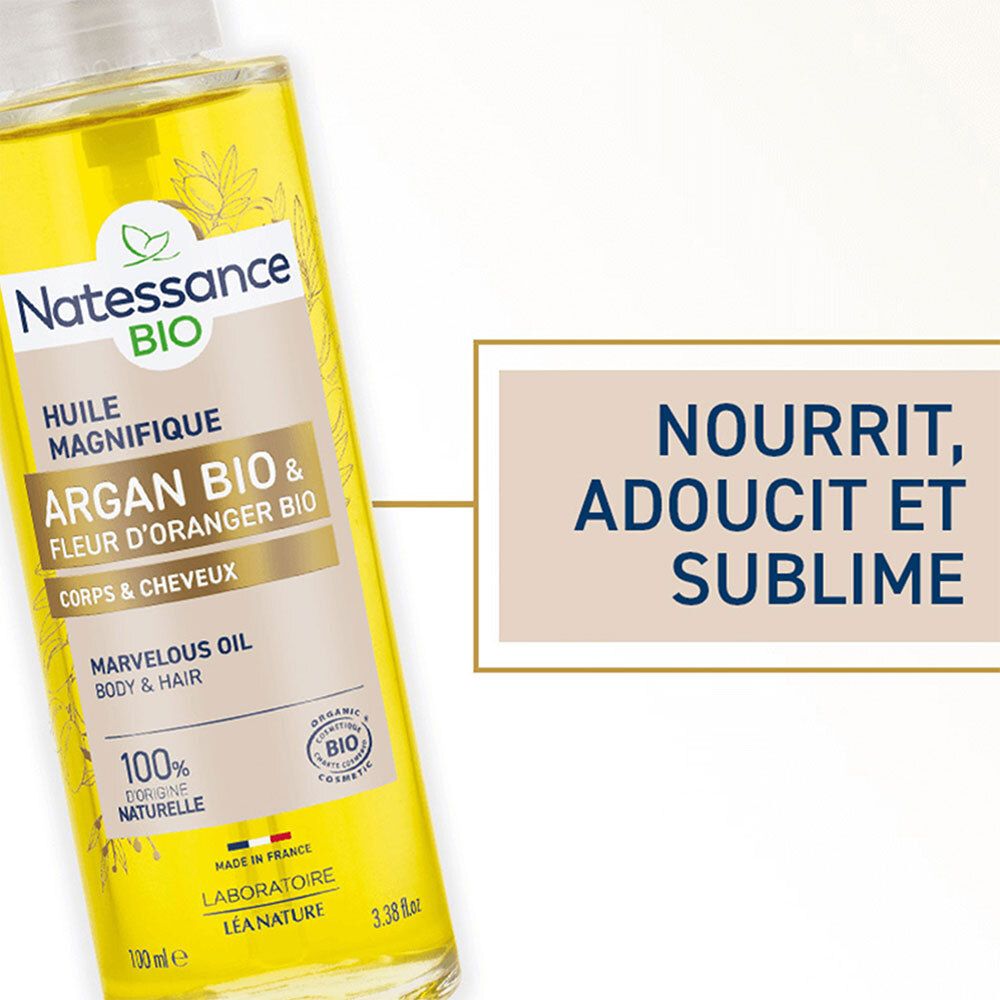Gros plan sur le flacon. Inscription: Natessance BIO, Huile Magnifique, Argan Bio & Fleur d'Oranger Bio, Corps & Cheveux. Texte: Nourrit, adoucit et sublime.