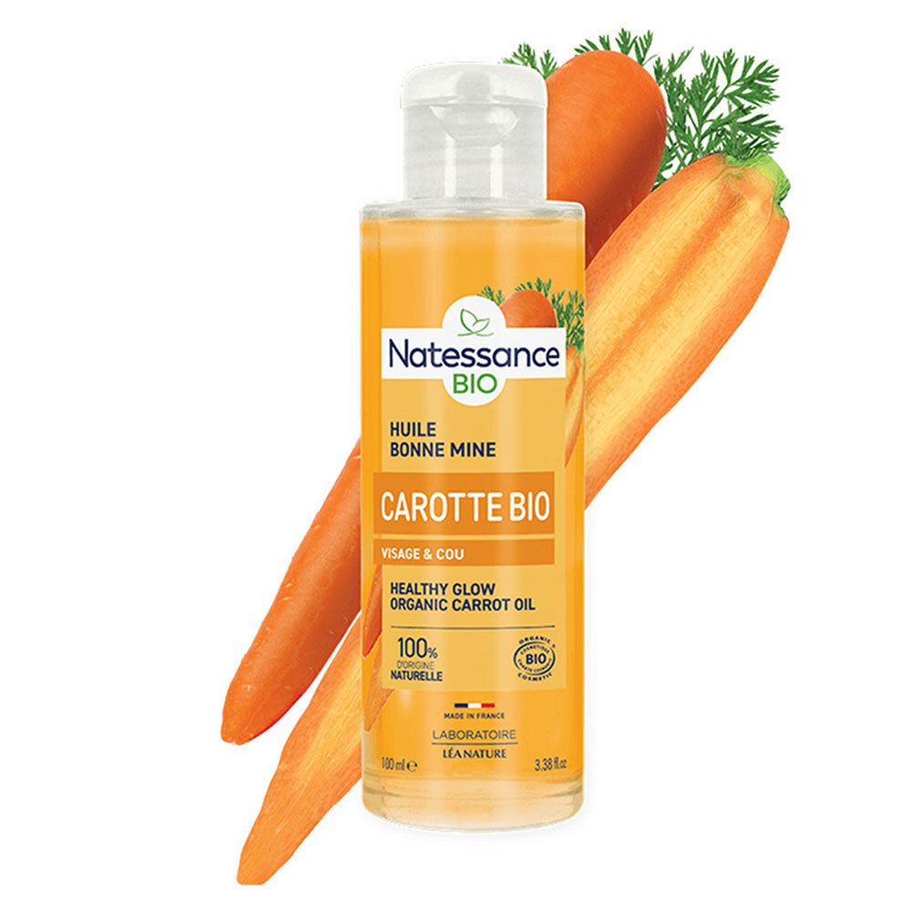 Flacon avec produit, carottes et tranches. Nom du produit et certification bio visibles.