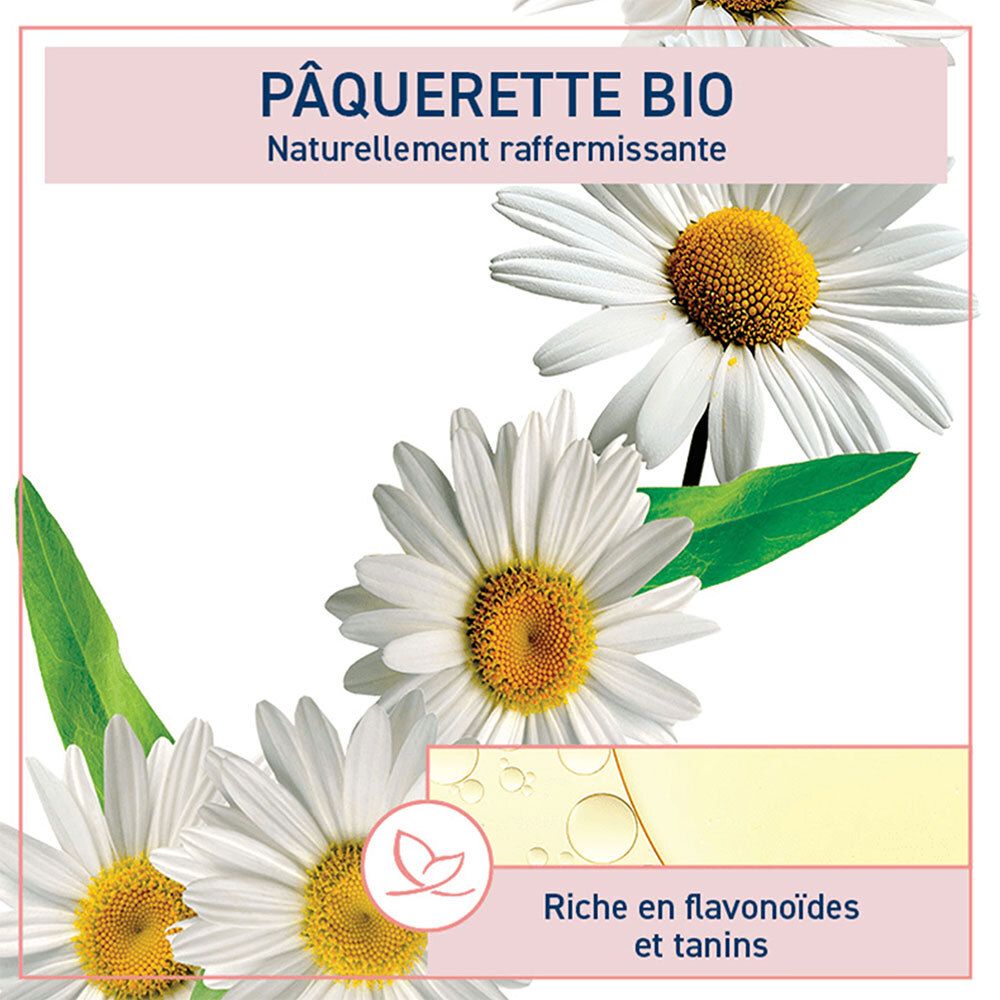 Détail : Étiquette rose avec texte Pâquerette Bio. Marguerites et liquide jaune.