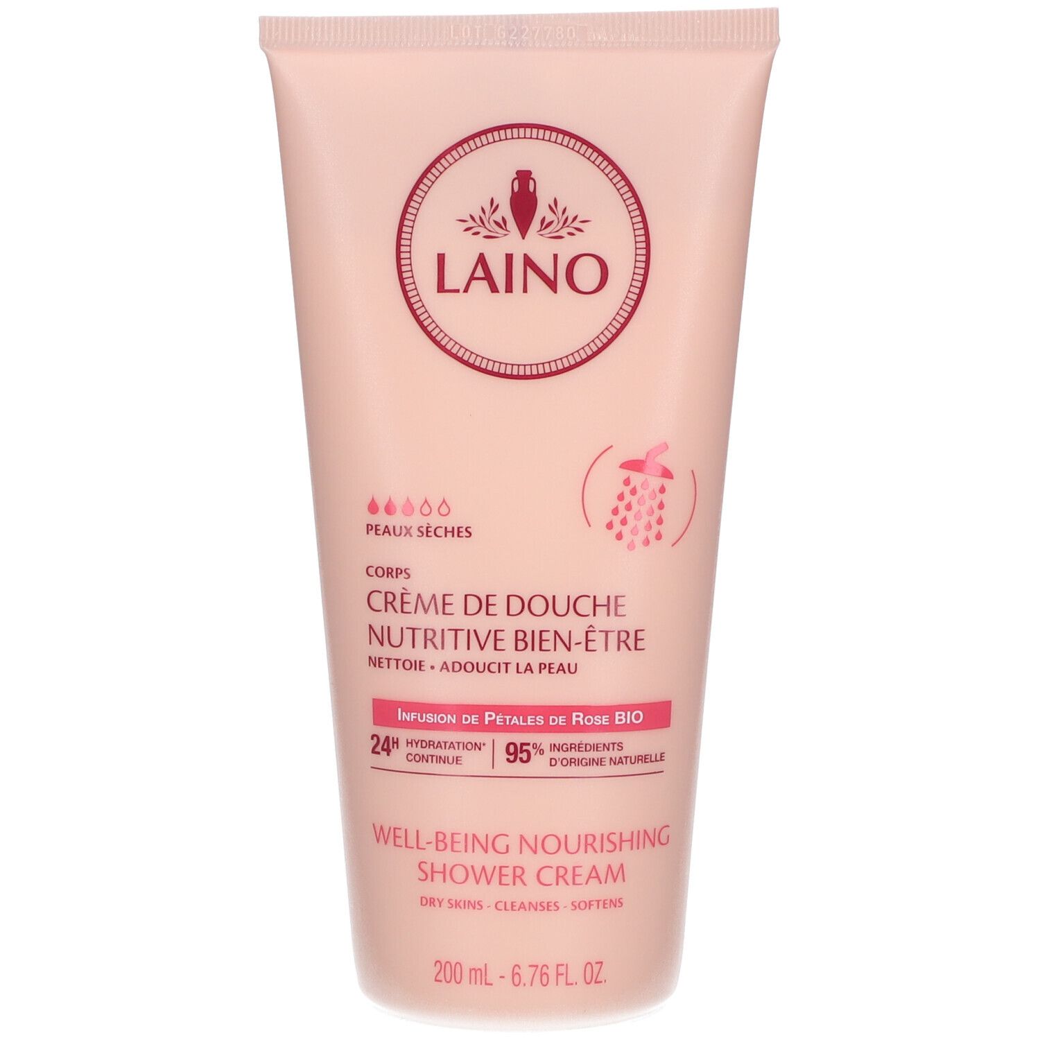 Tube rose avec bouchon blanc. Inscription: LAINO, Crème de douche nutritive bien-être. Texte et symboles.
