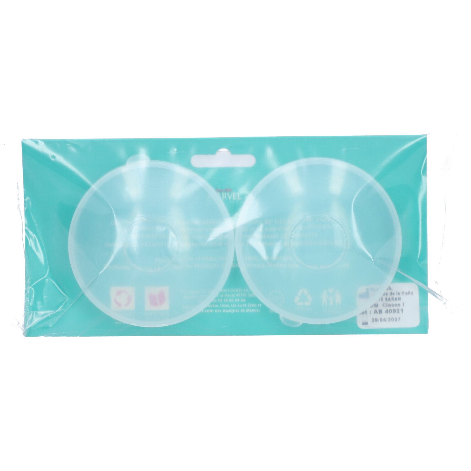 Deux Coquilles Recueil Lait transparentes dans emballage. Forme ronde, informations produit.